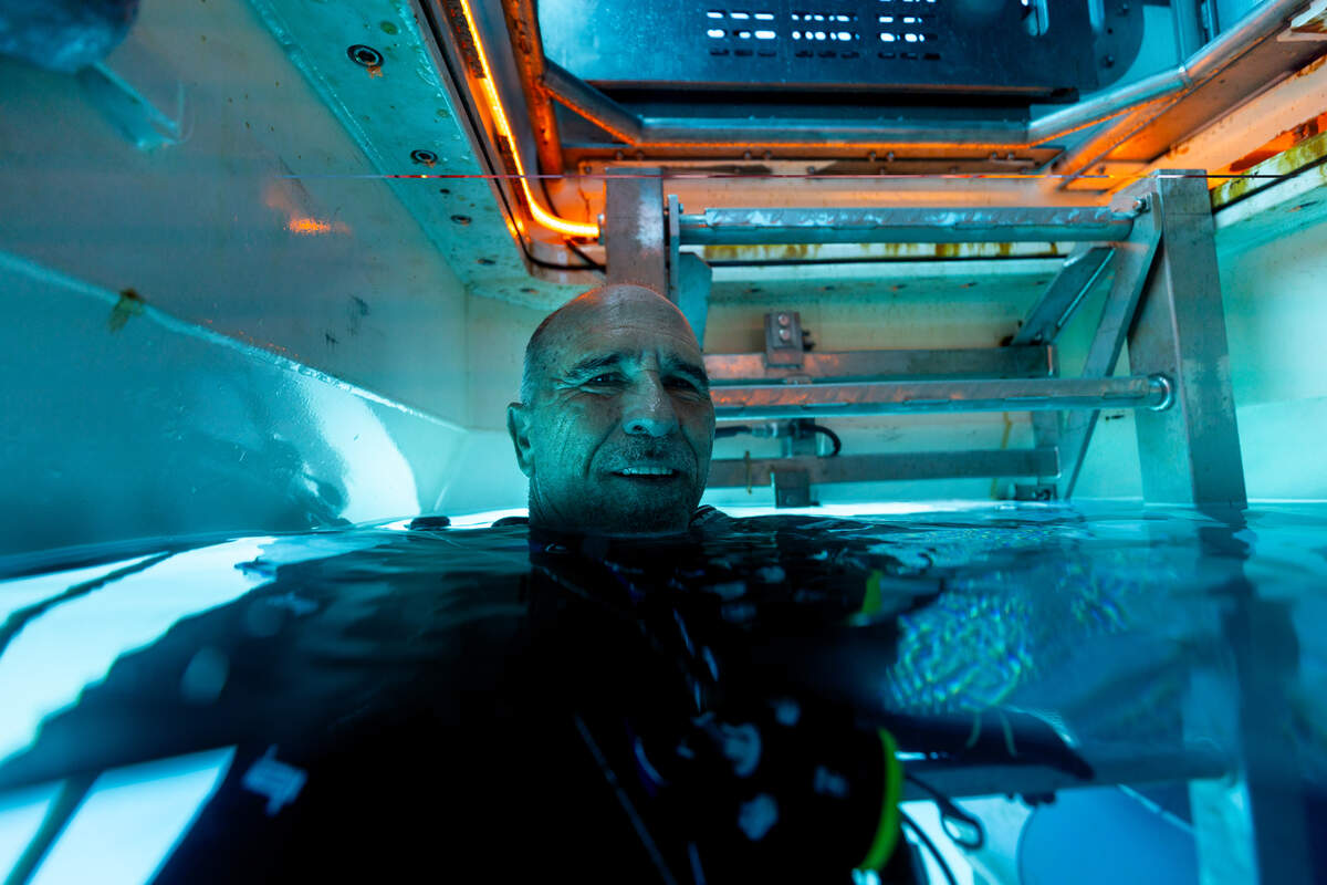 Roger Garcia, DEEP’s Director of Habitat Operations, coming up into Vanguard’s moon pool (entry and exit point).